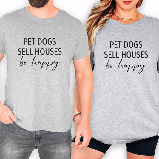 Two people wearing gray t-shirts with the text "PET DOGS SELL HOUSES be happy" printed on them.
