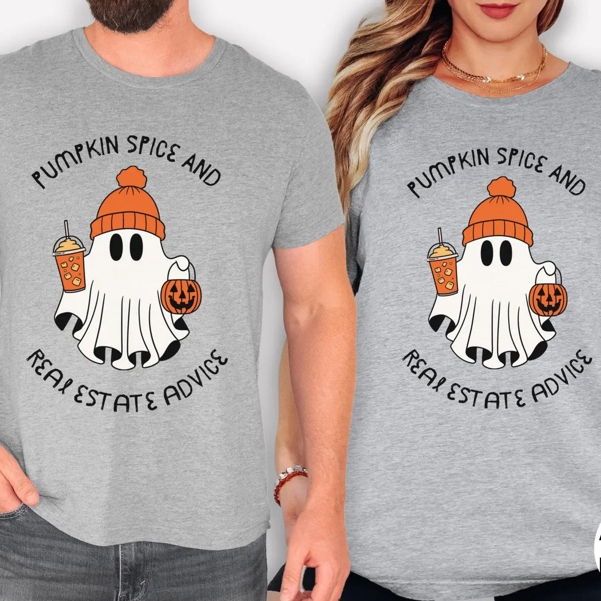 Two people wearing gray t-shirts with a ghost and pumpkin design and text.