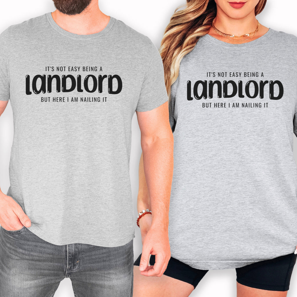 two people wearing gray t-shirts with the same text printed on them.