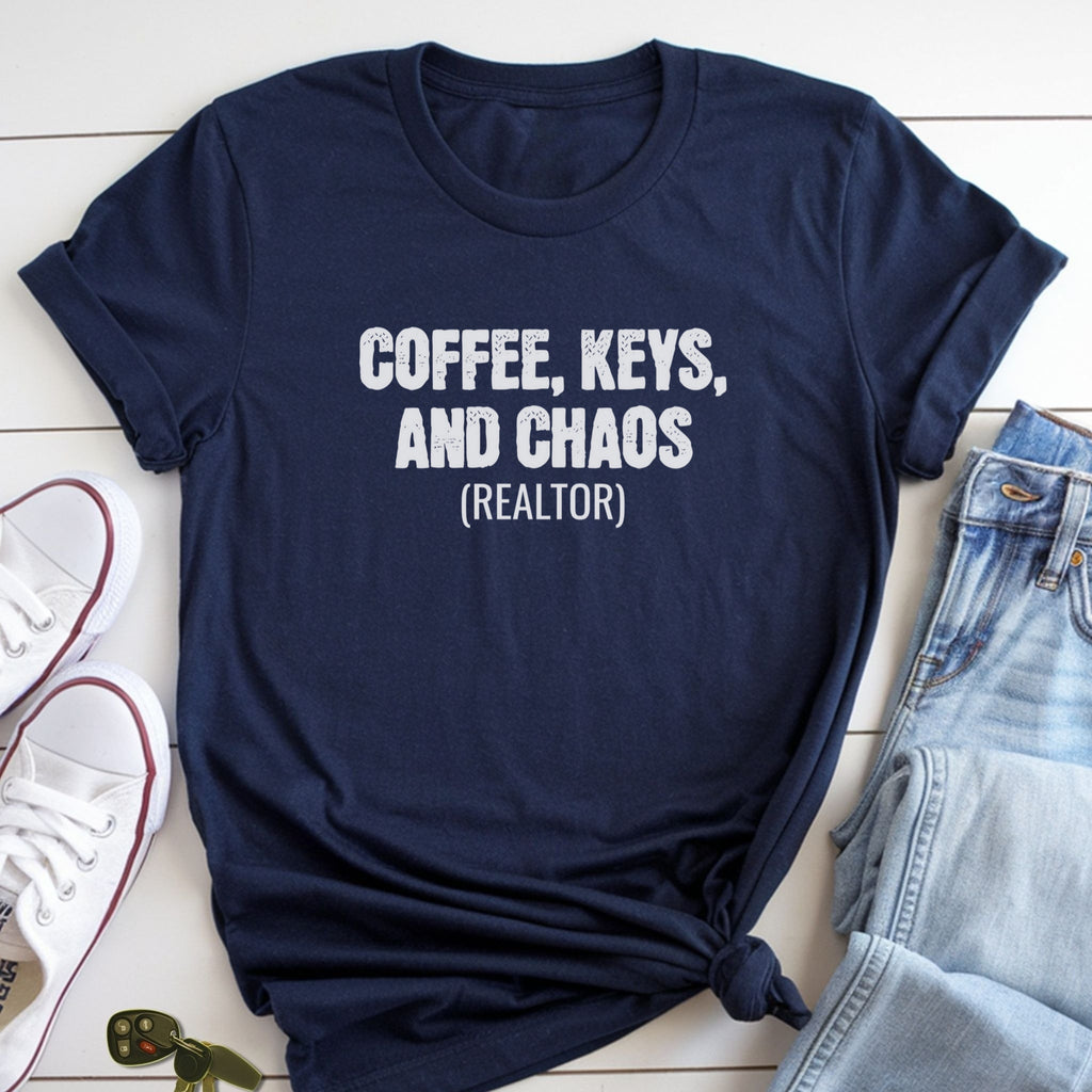 A navy blue t-shirt with the text "COFFEE, KEYS, AND CHAOS (REALTOR)" printed on it, along with a pair of jeans and a pair of white sneakers.