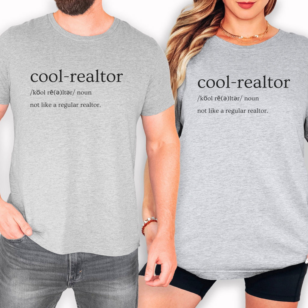 Two people wearing gray t-shirts with the definition of a "cool-realtor" printed on them.