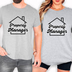 A man and a woman wearing matching gray t-shirts with the text "Property Manager" printed on them.