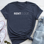 A dark blue t-shirt with the text "RENT IS DUE" printed on it, along with a pair of jeans and white sneakers.