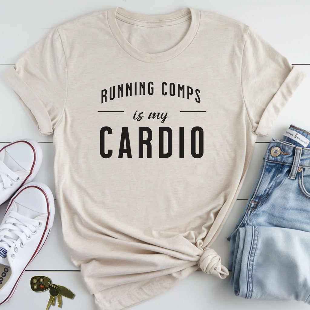 A beige t-shirt with the text "RUNNING COMPPS IS MY CARDIO" printed on it, along with a pair of jeans and sneakers.