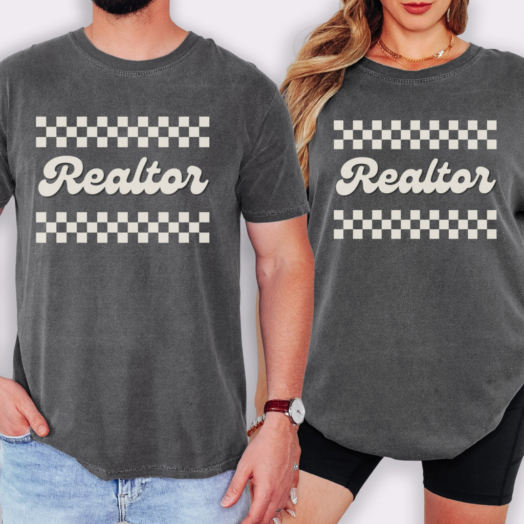 A man and a woman wearing matching gray t-shirts with the word "Realter" printed on them.