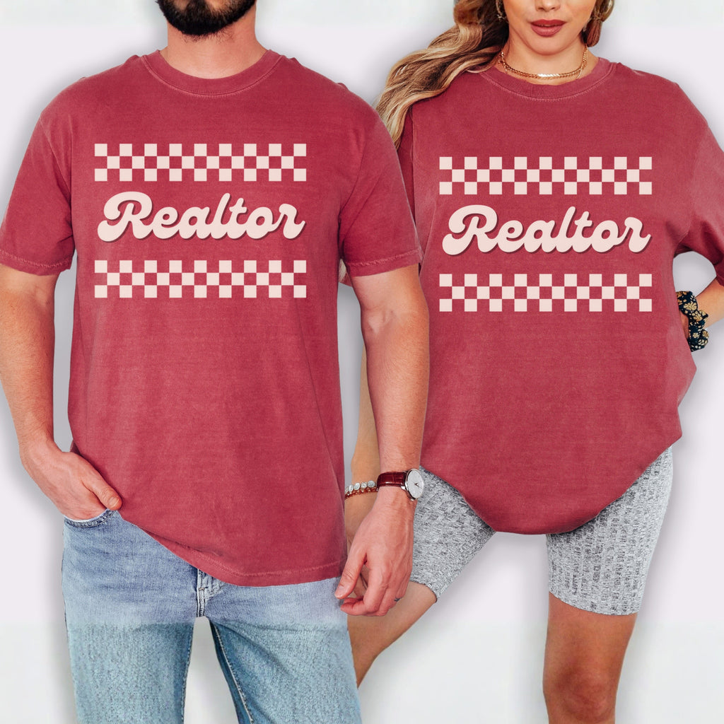 A man and a woman wearing matching red t-shirts with the word "Realtor" printed on them.