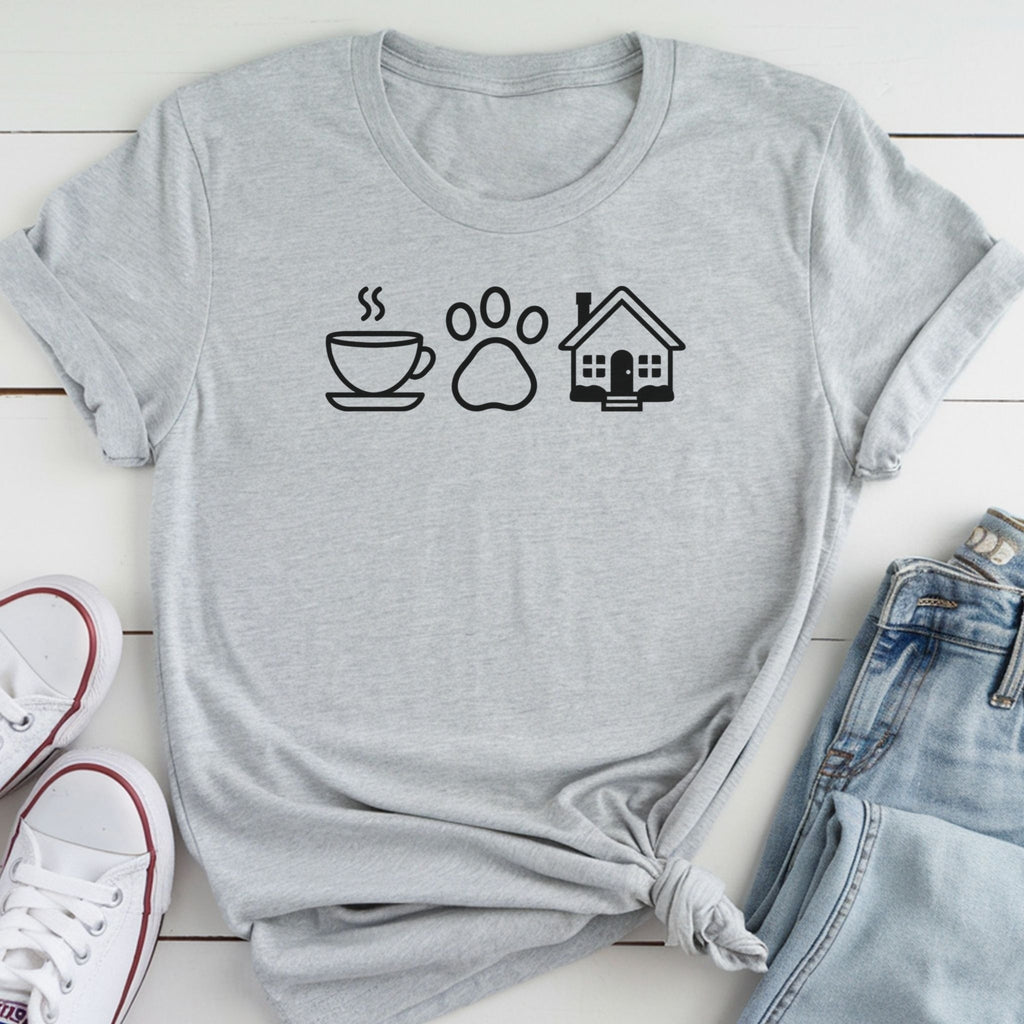 A gray t-shirt with a graphic design of a coffee cup, a paw print, and a house, along with a pair of jeans and white sneakers.