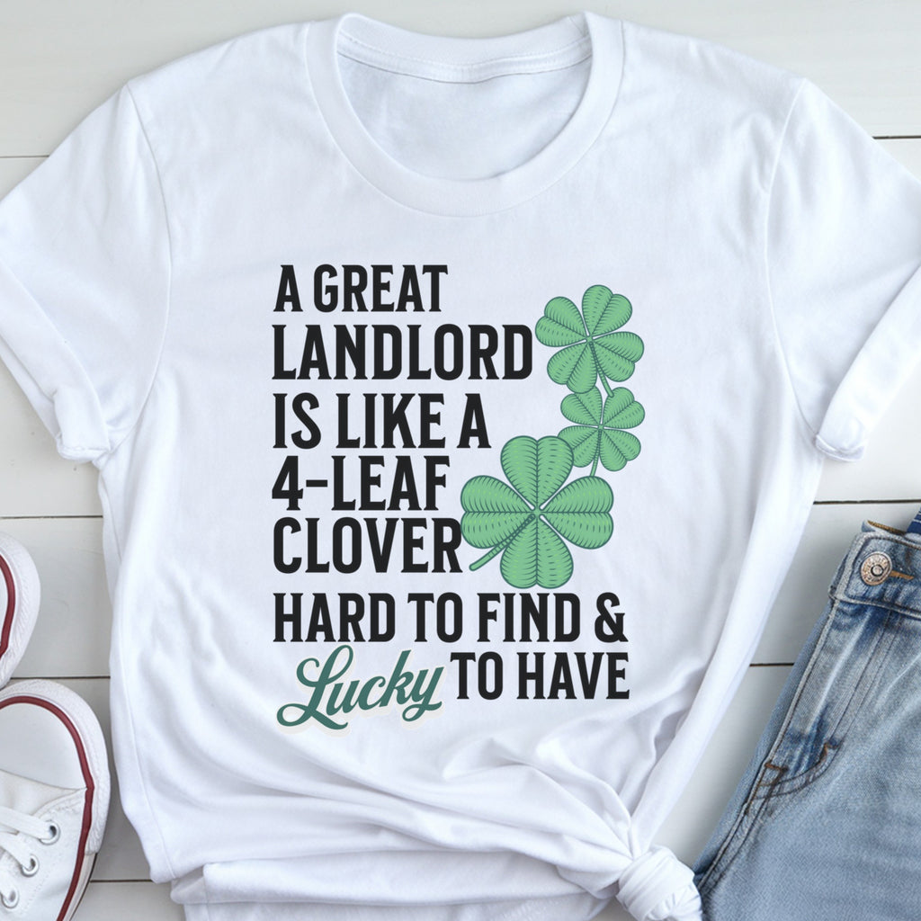 A white t-shirt with a humorous text and clover design printed on it.