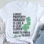 A white t-shirt with a humorous text and clover design printed on it.