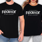 Two people wearing black t-shirts with white text that reads "IT'S NOT EASY BEING A REALTOR BUT HERE I AM NAILING IT".