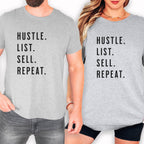 Two people wearing gray t-shirts with the same text printed on them.
