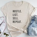 A beige t-shirt with the text "HUSTLE. LIST. SELL. REPEAT." printed on it, along with a pair of jeans and white sneakers.