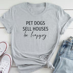 A gray t-shirt with the text "PET DOGS SELL HOUSES be happy" printed on it, along with a pair of jeans and white sneakers.