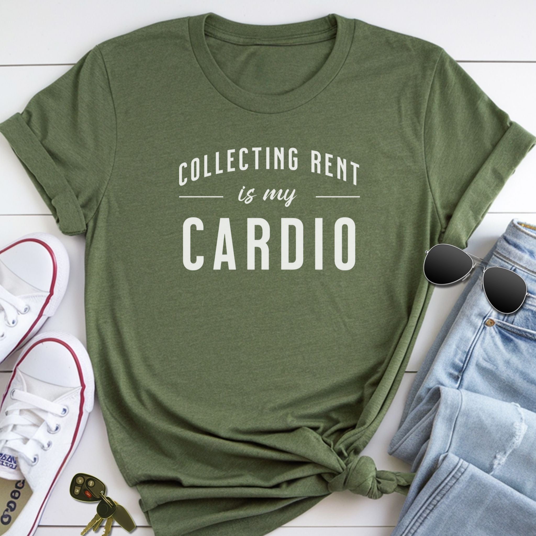 A green t-shirt with the text "COLLECTING RENT IS MY CARDIO" printed on it, along with a pair of sunglasses and a pair of sneakers.