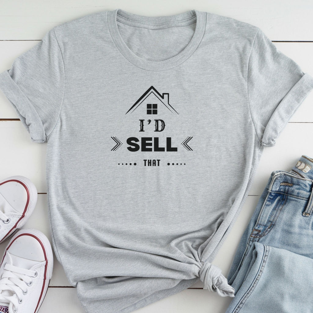 A gray t-shirt with a graphic design and text printed on it, along with a pair of jeans and white sneakers.