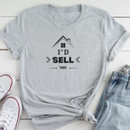 A gray t-shirt with a graphic design and text printed on it, along with a pair of jeans and white sneakers.