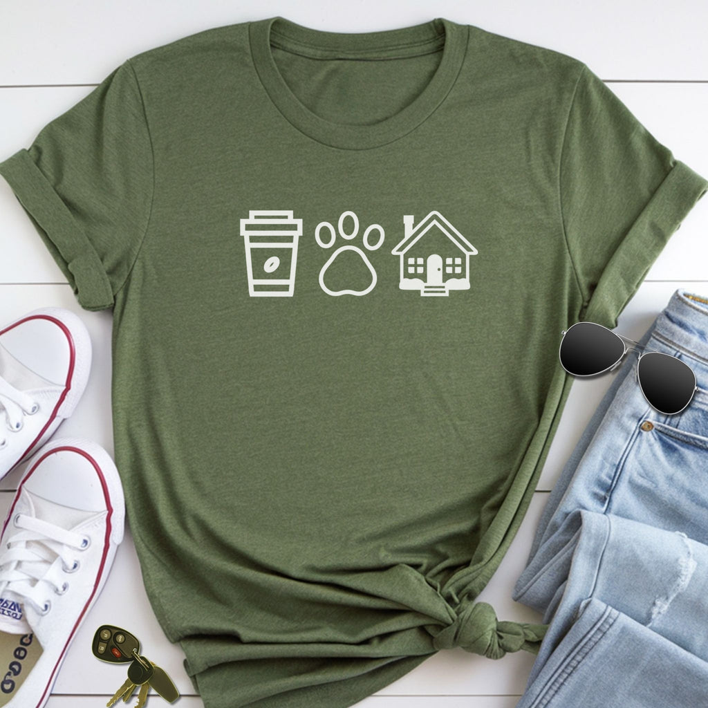 A green t-shirt with white icons of a coffee cup, a paw print, and a house, along with a pair of jeans, sunglasses, and a pair of white sneakers.