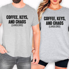 Two people wearing gray t-shirts with the text "COFFEE, KEYS, AND CHAOS (LANDLORD)" printed on them.