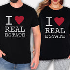 two people wearing black t-shirts with the text "I ♥ REAL ESTATE" printed on them.