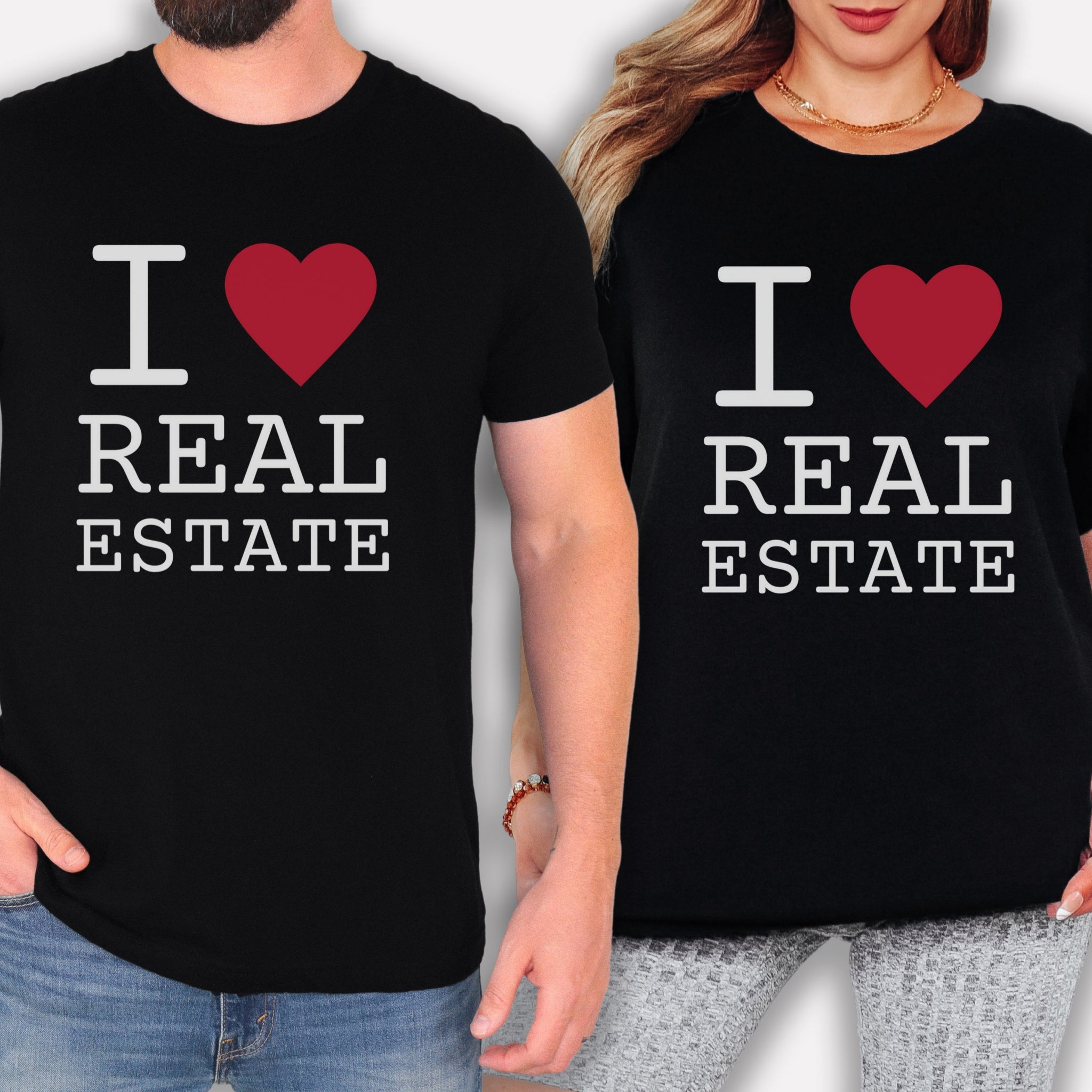 two people wearing black t-shirts with the text "I ♥ REAL ESTATE" printed on them.