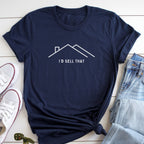 A navy blue t-shirt with a white graphic design and text, along with a pair of jeans and white sneakers, are laid out on a white surface.