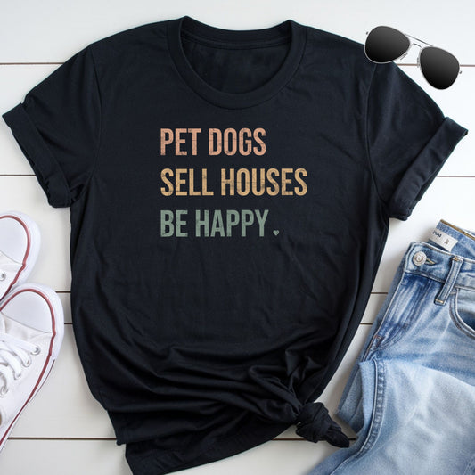 A black t-shirt with the text "PET DOGS SELL HOUSES BE HAPPY" printed on it, along with a pair of sunglasses and a pair of jeans.