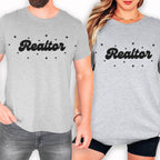 a man and a woman wearing matching gray t-shirts with the word "Realtor" printed on them.