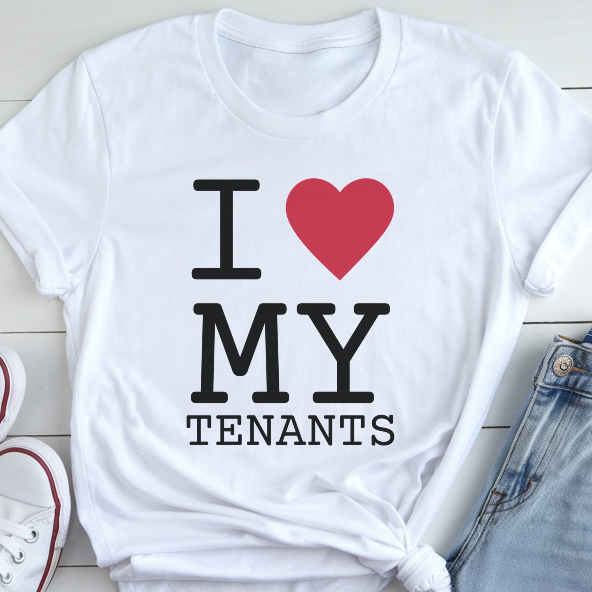 A white t-shirt with the text "I ❤ MY TENANTS" printed on it, along with a red heart symbol.