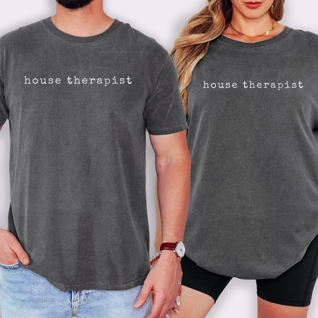 Two people wearing gray t-shirts with the text "house therapist" printed on them.