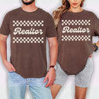 A man and a woman wearing matching brown t-shirts with the word "Realtor" printed on them.