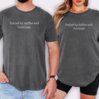 Two people wearing gray t-shirts with the text "fueled by coffee and closings" printed on them.