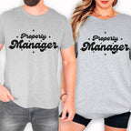 A man and a woman wearing matching gray t-shirts with the text "Property Manager" printed on them.