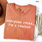 a red t-shirt with the text "Everyone relax, I'm a realtor" printed on it.