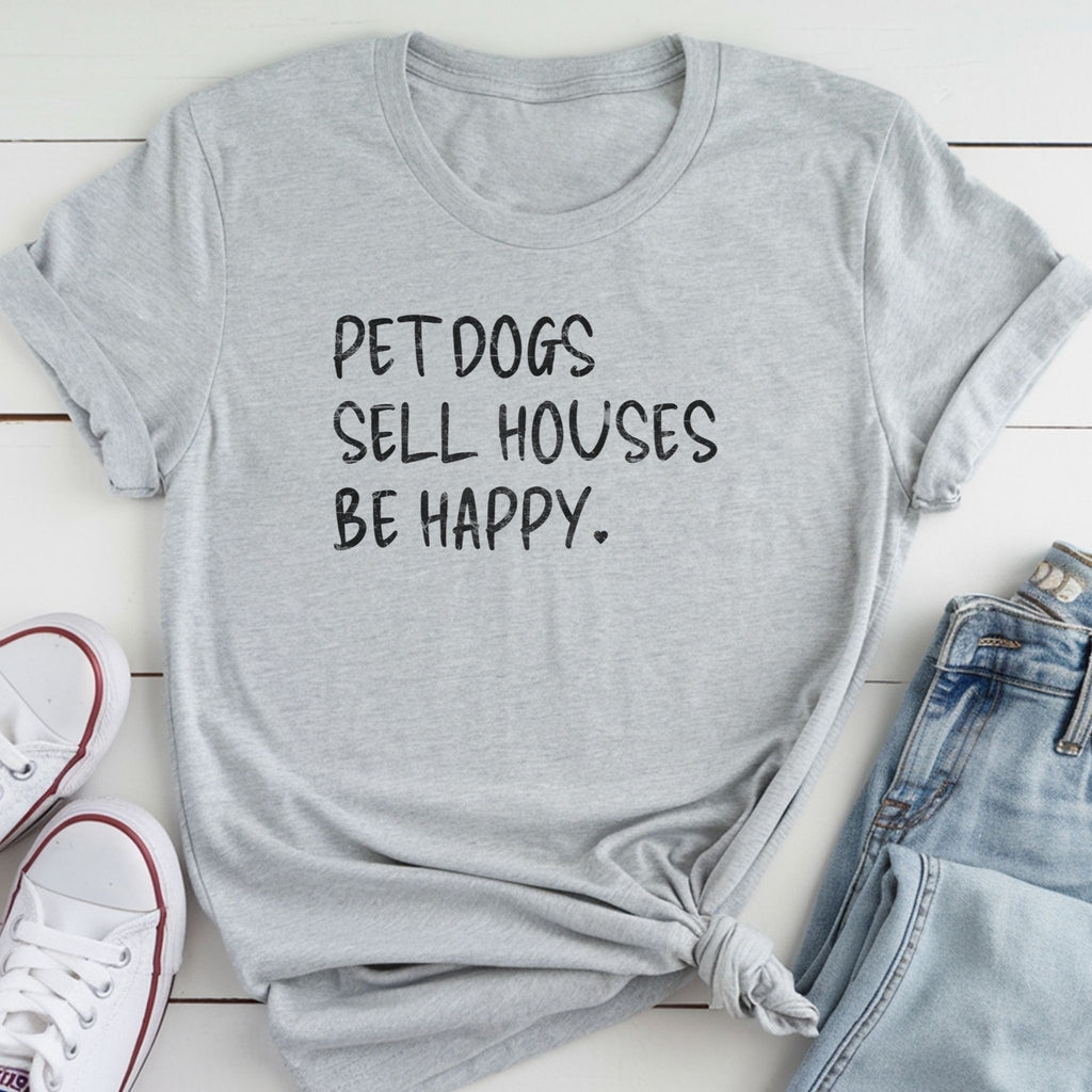 A gray t-shirt with the text "PET DOGS SELL HOUSES BE HAPPY" printed on it, along with a pair of jeans and white sneakers.