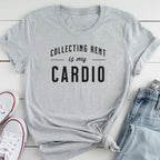 A gray t-shirt with the text "COLLECTING RENT IS MY CARDIO" printed on it, along with a pair of jeans and white sneakers.
