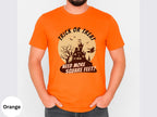 Orange t-shirt with Halloween-themed design featuring a castle and text, worn by a realtor