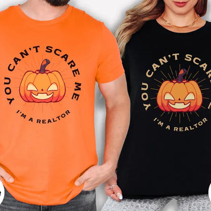 Two people wearing Halloween-themed t-shirts with a pumpkin graphic and text.